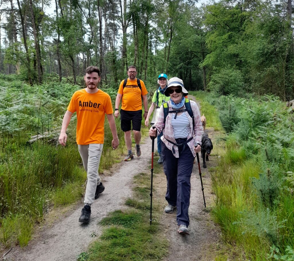 4 people walking at last year's Hike the Hill fundraising event.