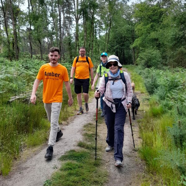 4 people walking at last year's Hike the Hill fundraising event.